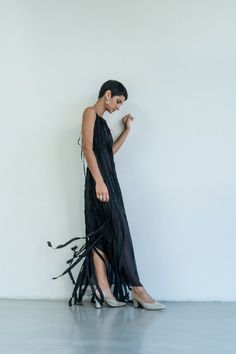 This enchanting Teatralna Black dress is a vision of grace, fashioned entirely from 100% silk. Its backless allure adds a hint of sensuality, while the dual layers of silk add depth and texture. The distinctive feature lies in the top layer, composed of vertical stripes that elegantly run longer than the bottom layer, creating a captivating play of length and movement. The arrangement of these strips imparts a unique, modern charm to the gown, making it a standout choice for those seeking a blen Strips Dress, Gown Making, Design Composition, Timeless Luxury, Stripped Dress, Under Dress, Vertical Stripes, Dress 100, Pure Silk