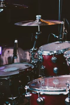 the drums are sitting on the stage ready to play