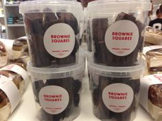 some brownie squares are in plastic containers