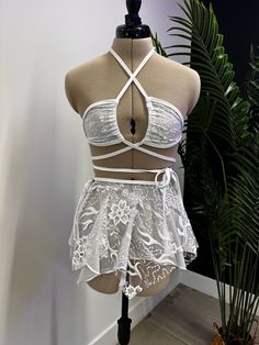 Elevate your rave wardrobe with our Seraphina Fairy Skirt. A versatile, tie-any-way skirt that flatters and fits all your festive moments. Flirty Lace Skirt For Party, Flirty Lace Party Bottoms, White Skirt For Spring Costume Party, Lace Fitted Beach Skirt, Fitted Lace Skirt For The Beach, White Skirt For Summer Costume Party, White Skirt For Costume Party In Summer, White Summer Skirt For Costume Party, Summer Dancewear Skirt For Party