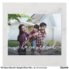 a photo card with the words we have moved and two people standing in front of a house