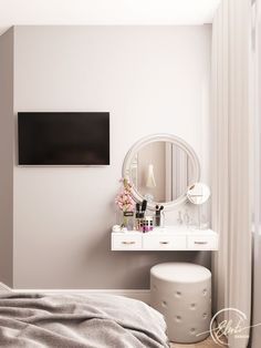 a bedroom with a white dresser and mirror