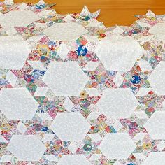 a close up of a quilt on a table