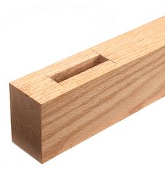 a wooden block with a hole in the middle and one section missing from it's surface