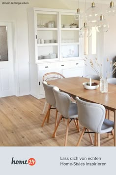 a dining room table with chairs around it