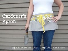 a woman holding an umbrella in front of a gray house with the words gardener's apron on it