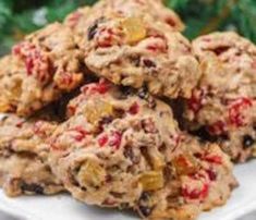 a pile of cookies sitting on top of a white plate