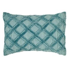 a blue pillow with diamond pattern on the front and back, sitting on a white background