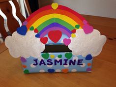 a paper box with hearts and rainbows on the top that says jasmine