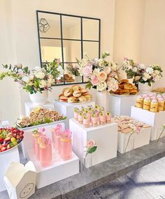 an assortment of desserts and pastries on display at a wedding or bridal party