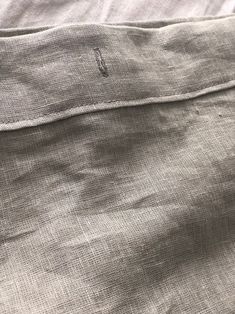 close up view of the fabric on a bed