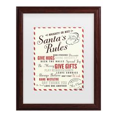 the santa's rules framed print is shown in a brown frame with red and white lettering