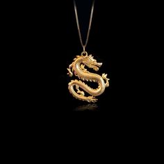 Unleash your inner fire with our Dragon pendant. Crafted with exquisite detail, this powerful piece embodies the untamed strength and mystique of the dragon, a symbol of wisdom and fierce protection. Feel the energy of this ancient guardian as it wraps you in its embrace, reminding you of your own unyielding spirit and the burning passion within. PENDANT INFORMATIONThis pendant is made of real, solid gold.• Made in USA• Material: 14k or 18k solid gold• Finish: polished• Height: 1.22" (31 mm) x W Traditional Gold Jewelry With Dragon Design, Traditional Dragon Design Collectible Jewelry, Spiritual Gold Jewelry With Dragon Design, Dragon Design Pendant Amulet Jewelry, Symbolic Gold Dragon Jewelry, Symbolic Gold Jewelry With Dragon Design, Gold Dragon Design Round Pendant Jewelry, Gold Round Pendant With Dragon Design, Mythological Style Yellow Gold Jewelry As Gift