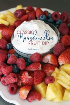 assorted fruits arranged on a white plate with the words classic marshmallow fruit dip