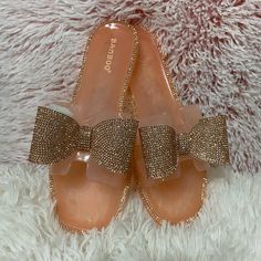 Rhinestone Bow Jelly Sandals- Rose Gold Pink Embellished Synthetic Sandals, Pink Flat Sandals With Rhinestones, Glamorous Pink Sandals For Beach, Glamorous Pink Beach Sandals, Gold Jelly Sandals For Spring Party, Rhinestone Bow, Jelly Sandals, Casual Flats, Rose Gold Color