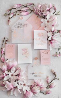 pink and white wedding stationery with flowers