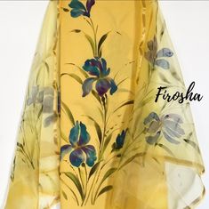 a yellow scarf with flowers on it and the words fresha written in black