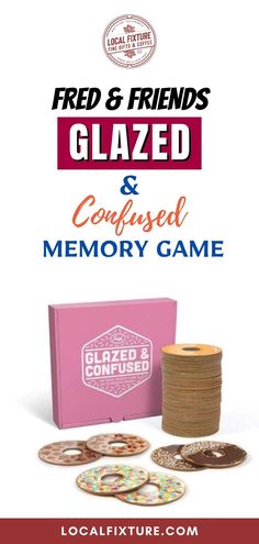 a pink box filled with lots of different types of game pieces and cards on top of it