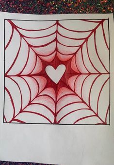 a drawing of a spiderweave with a heart in the center on top of it