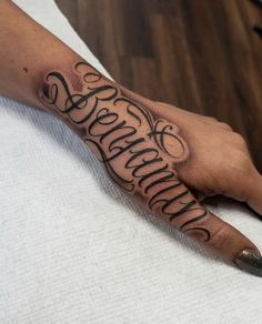 a person's hand with a tattoo on it and the word savannah written in cursive writing