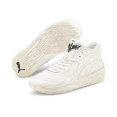 a pair of white sneakers with black accents on the upper part of the shoe and sole