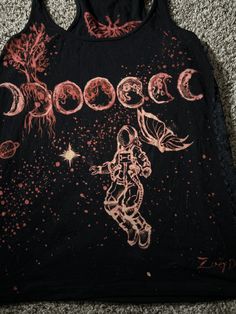 a black tank top with an astronaut on it