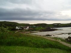 an ocean view with houses on the shore