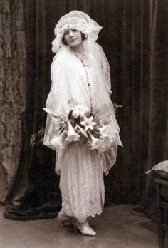 an old black and white photo of a bride