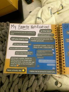 an open notebook with the words my favorite notifications on it sitting on a bed