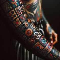 a person with tattoos on their arms and arm