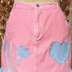 This adorable pink skirt is custom dyed and features custom made adorable pastel heart dot appliques. Features a cute matching ruffle trim. Denim skirt buttons closed and has all functional pockets. Denim has no stretch, so please take note of measurements.  Waist- up to 31" Hips- up to 40.5" Length- 17" Pink Heart Skirt Midi, Denim Pink Skirt With Pockets, Pink Mini Denim Skirt, Pink Denim Mini Skirt With Pockets, Kawaii Denim Skirt, Hip Ups, Pink Skirt, Ruffle Trim, Pastel Pink