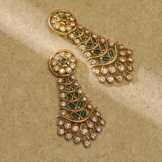 Description This Tarinika earrings are truly elegant. It features kempu and CZ stones arranged in a beautiful design creating an attractive contrast with its antique-gold tone plating. The design's simple elegance makes it suitable for weddings and special events. Style them on lehengas or tunics. Details & Specifications: Materials used: Brass Alloy with Antique Plating Weight - Earrings 13 gm Length - Earrings 5.5 cm Make it custom Want to make it a custom earring? Sure! Reach out to us at sup Trending Gold Earrings, Indian Jewellery Aesthetic, Gold Jhumkas, Vintage Indian Jewelry, Victorian Style Earrings, Indian Designs, Churidar Designs, Fancy Jewelry Necklace, Gold Earrings Wedding