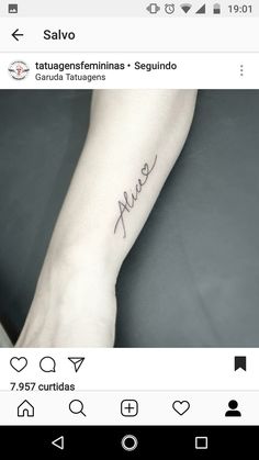 a person with a tattoo on their arm that says love and is written in cursive