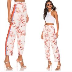 Quisy Cropped Floral & Stripe Pants In Porcelain Trendy Lounge / Have That Trendy Pajama Feel That Is Very Popular Right Now. Can Be Dressed Up Or Down And Very Comfortable Beautiful Floral Pattern All Over With A Almost Rainbow Stripe Down The Sides ( Yellow, Purple, Red, Terra Cotta) Perfect Addition To A Fall Wardrobe Fabric: Crepe Contrast Side Stripes Floral Print Straight-Cut Style Ankle Length Drawstring At Waist Slant Hip Pockets Lined Shell: 100% Viscose Lining: 100% Polyester White Floral Print Ankle-length Bottoms, White Floral Print Ankle-length Pants, White Floral Print Summer Pants, White Floral Print Pants, White Floral Print Pants For Summer, White Floral Print Straight Pants, Spring Printed White Pants, White Floral Print Trousers, White Floral Print Loungewear Bottoms