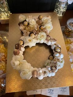 a table topped with lots of different types of flowers on top of a wooden table