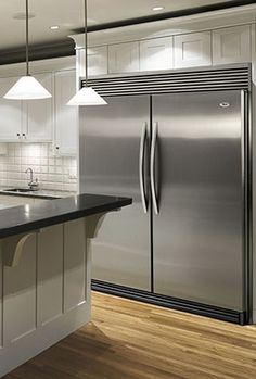 a large stainless steel refrigerator in a kitchen