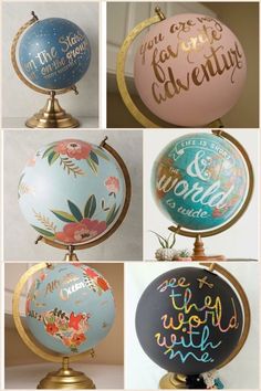 four different globes with hand painted lettering on them and the words in each one