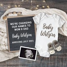 a baby announcement is shown with shoes and an infant's booties next to it