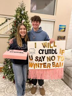 two people standing next to each other holding a sign that says i will crumb if u say no to winter bail