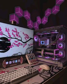 a computer desk with a keyboard, mouse and monitor covered in purple lights on it