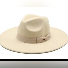 Wide Brim Hat With Small Bow Chic Beige Flat Brim Hat, Cream Fedora Hat One Size Fits Most, Chic Cream Adjustable Hat, Cream Brimmed Fedora One Size Fits Most, Classic Cream Felt Hat For Beach, Adjustable Chic Cream Fedora, Chic Adjustable Beige Felt Hat, Beige Brimmed Felt Hat For Vacation, Casual Cream Fedora For Winter