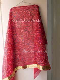 Red cotton Bandhani dupatta with golden gota border on one side. Traditional Indian red art scarf. It is used mostly for wedding purposes. Dimension: Length: 2.18 meter Width: 1.05 meter Marwari Wedding, Jaipuri Suits, Bandhej Dupatta, Bandhani Dupatta, Big Rangoli, Big Rangoli Designs, Kurta Dress, Art Scarves, Red Scarf