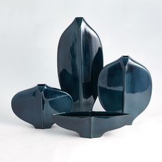 three blue vases sitting on top of each other