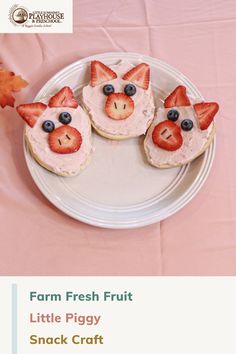 three little pigs made out of fruit on top of a white plate with pink table cloth