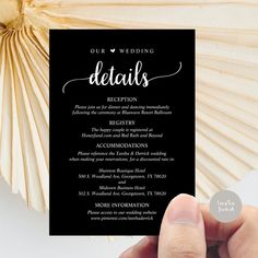 a hand holding up a black and white wedding card with the word details on it