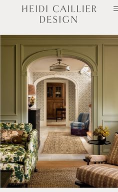 a living room with green walls and furniture