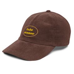 Step up your style with a Lake Oconee embroidered old-school cap. It’s crafted from 100% cotton corduroy that’s soft to the touch and comfy to wear. It features an adjustable strap with a gold-colored buckle for a great fit and a visor to protect you from the sun and wind. Complete your look with this embroidered corduroy cap and rock a cool vibe all day long.• 100% cotton corduroy• Cotton twill sweatband and taping• Adjustable strap with a gold-colored metal buckle• Head circumference: 20″–22″ Adjustable Brown Corduroy Dad Hat, Corduroy Snapback Baseball Cap For Outdoor, Cheap Corduroy Baseball Cap, Outdoor Corduroy Baseball Cap With Curved Brim, Retro Adjustable Corduroy Baseball Cap, Vintage Corduroy Cap, Corduroy Baseball Cap With Curved Brim, One Size, Lake Oconee, Home Themes