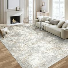 a living room filled with furniture and a large rug on top of a hard wood floor