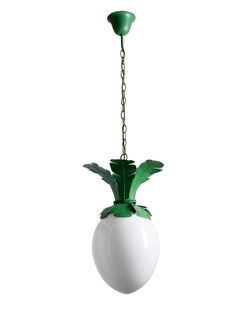 a white and green pineapple hanging from a metal chain on a light fixture in the shape of a ball