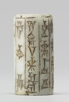 a white vase with writing on it